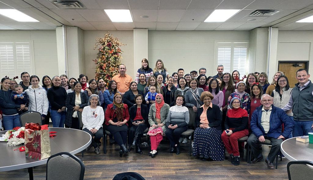 Students in the ESL program of South Tulsa Baptist Church gather for a Christmas luncheon. The church offers 54 hours of ESL training each week in three locations.