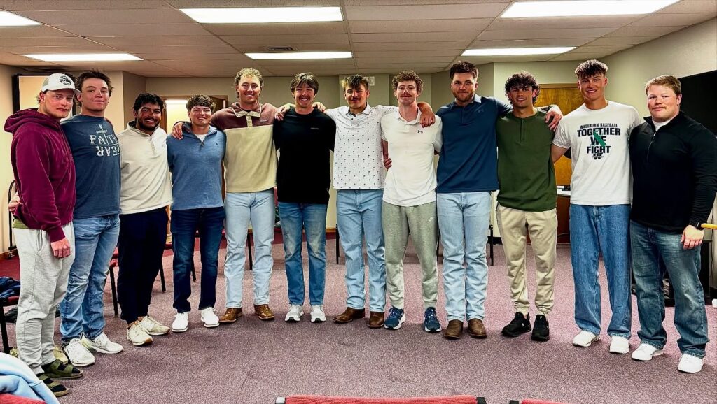 Topeka church baptizes 12 members of college baseball team, product of intentional discipleship