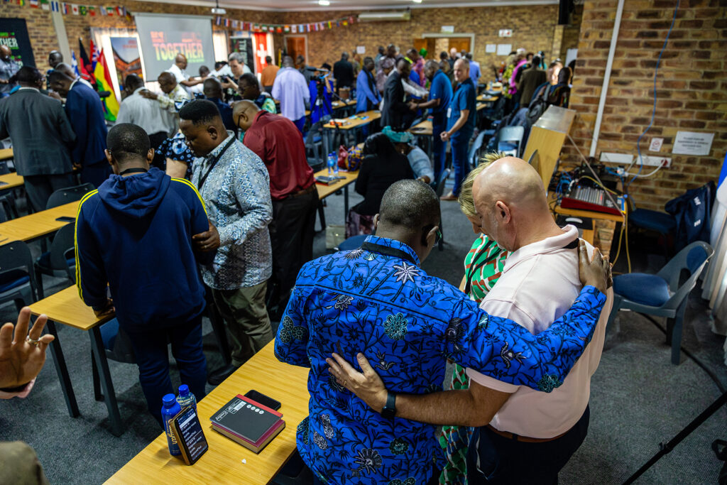 Attendees pray together during the Together Africa to the Nations conference in Johannesburg South Africa February 2026